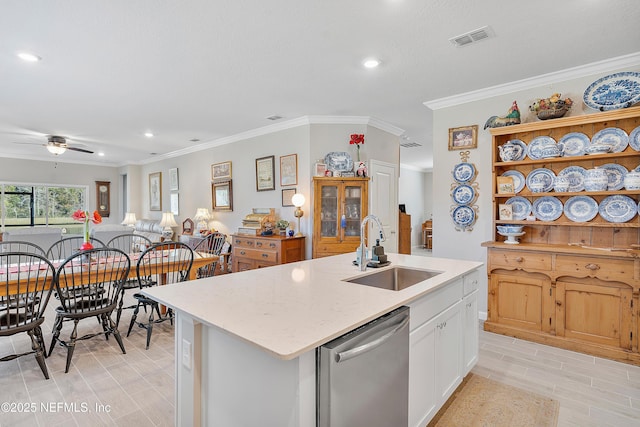 kitchen featuring white cabinets, ceiling fan, sink, a center island with sink, and dishwasher