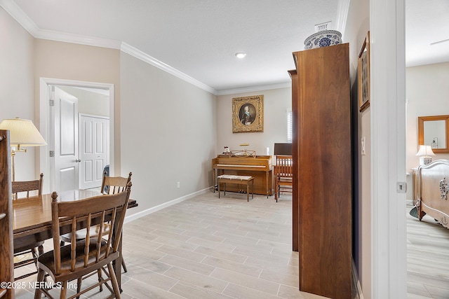 dining space featuring ornamental molding