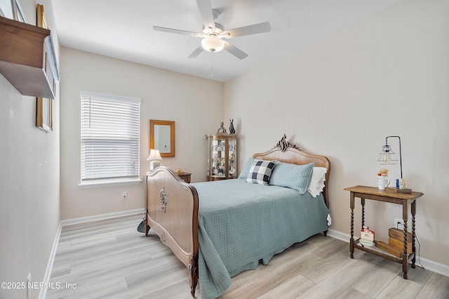 bedroom featuring light hardwood / wood-style floors and ceiling fan