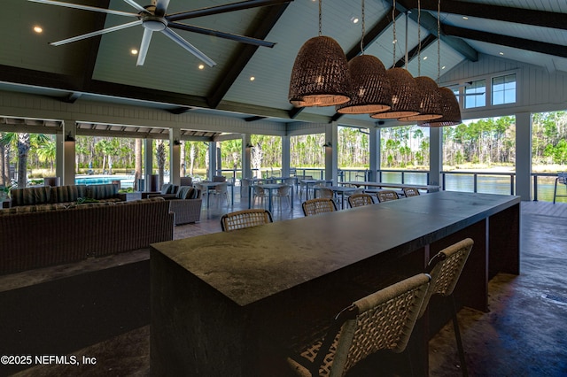 dining room with beam ceiling, high vaulted ceiling, and ceiling fan