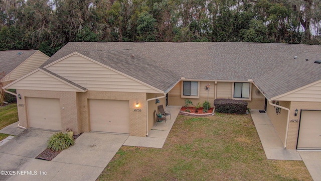 ranch-style home with a front yard and a garage