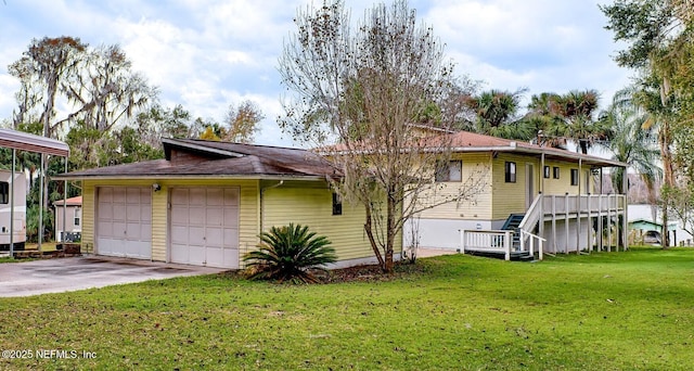 single story home with a front lawn and a garage