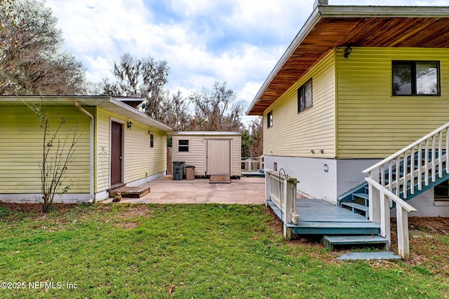 exterior space with a patio and a shed