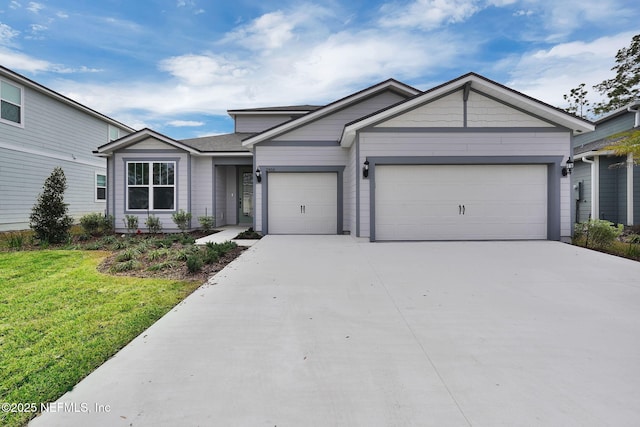 single story home with driveway, a front lawn, and an attached garage