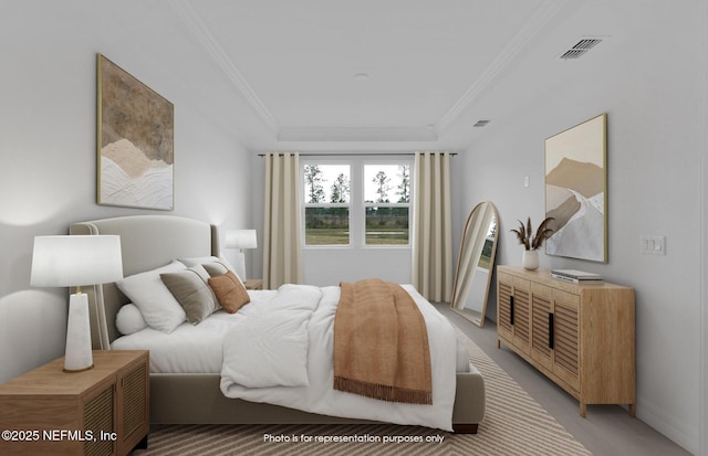 bedroom featuring crown molding, visible vents, and a raised ceiling