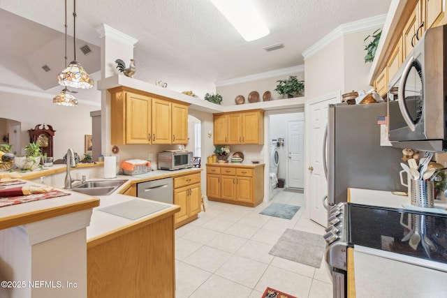 kitchen featuring appliances with stainless steel finishes, a textured ceiling, kitchen peninsula, and light tile patterned floors