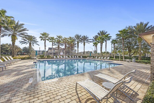 view of swimming pool with a patio area