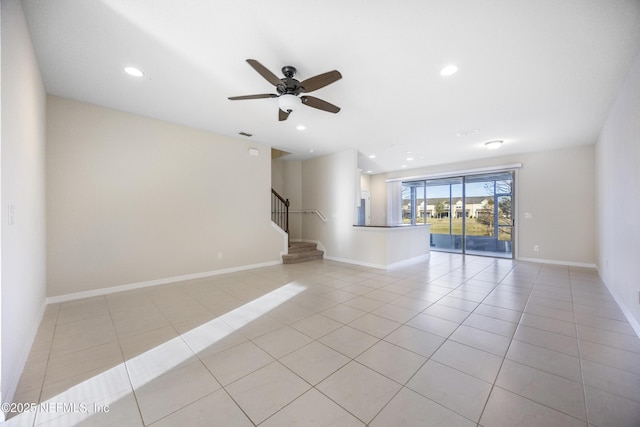 tiled empty room with ceiling fan