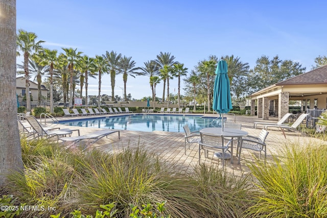 view of swimming pool with a patio area