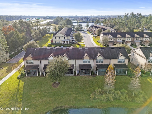 birds eye view of property featuring a water view