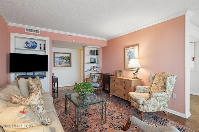 living room featuring dark parquet floors, crown molding, built in features, and a textured ceiling