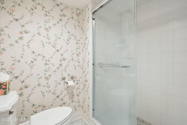 bathroom featuring toilet and walk in shower