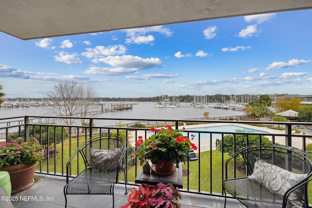 balcony featuring a water view