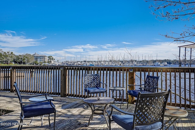 wooden deck featuring a water view