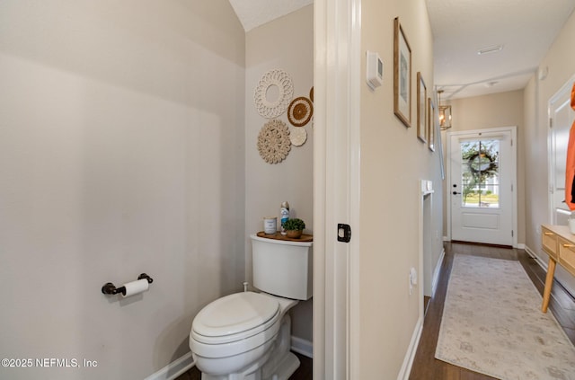 bathroom featuring toilet and hardwood / wood-style floors