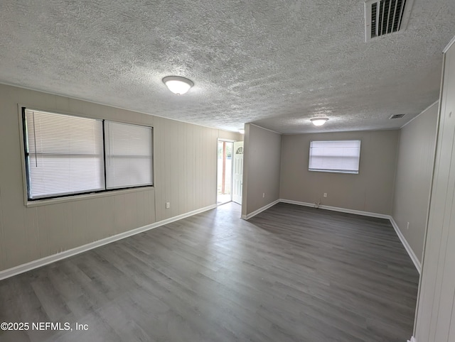 empty room featuring hardwood / wood-style floors