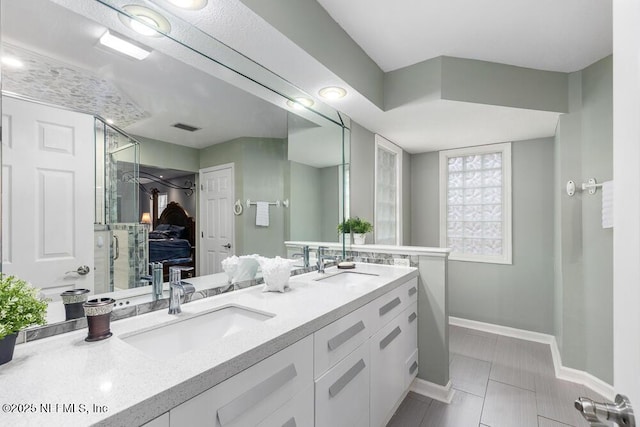 bathroom featuring tile patterned flooring and vanity