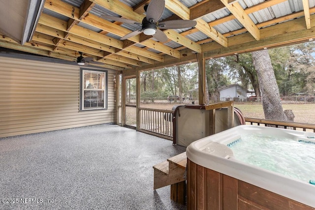 exterior space with ceiling fan and a jacuzzi