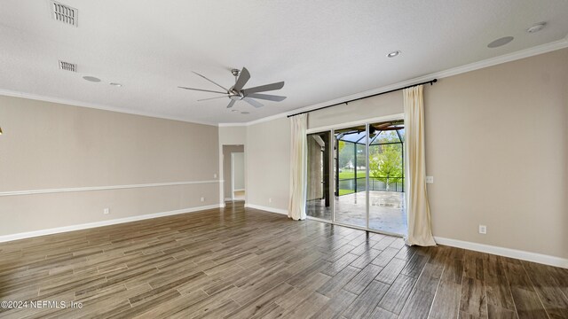 unfurnished room featuring ceiling fan and crown molding