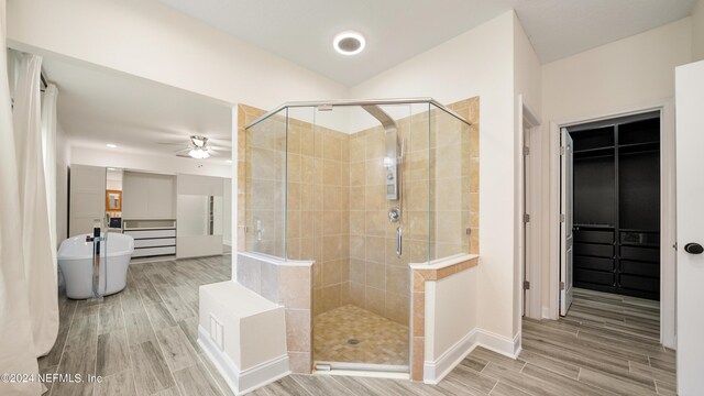 bathroom with ceiling fan and independent shower and bath