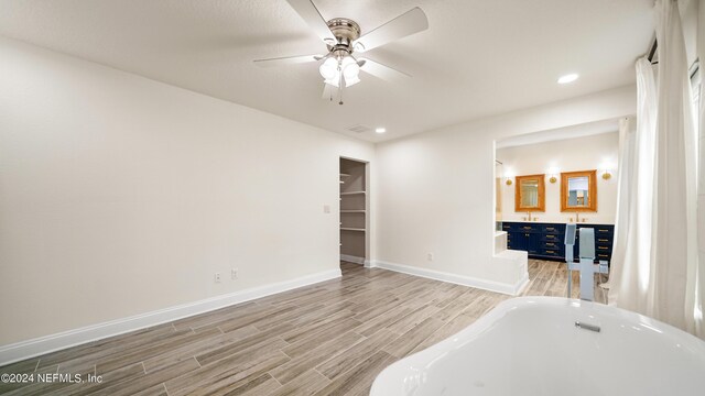 empty room featuring light hardwood / wood-style flooring and ceiling fan