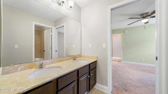 bathroom with vanity and ceiling fan