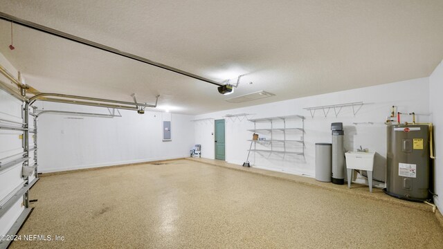 garage with electric water heater, electric panel, a garage door opener, and sink