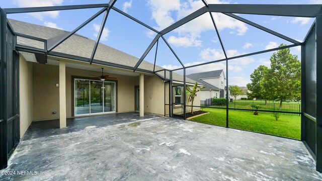 view of patio / terrace with ceiling fan and glass enclosure