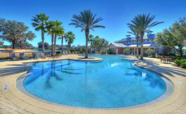 view of pool featuring a patio area