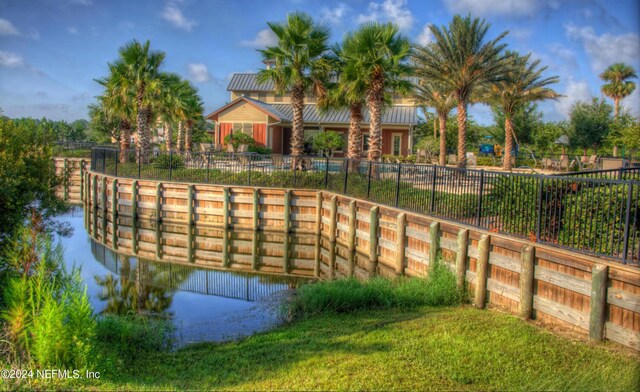 view of home's community featuring a water view