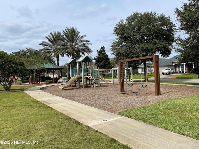 communal playground featuring a yard