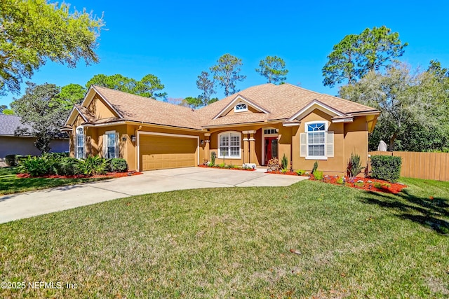 single story home featuring a front lawn, fence, an attached garage, and stucco siding