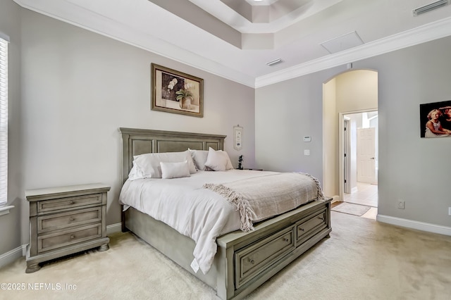 bedroom featuring arched walkways, crown molding, light colored carpet, visible vents, and baseboards