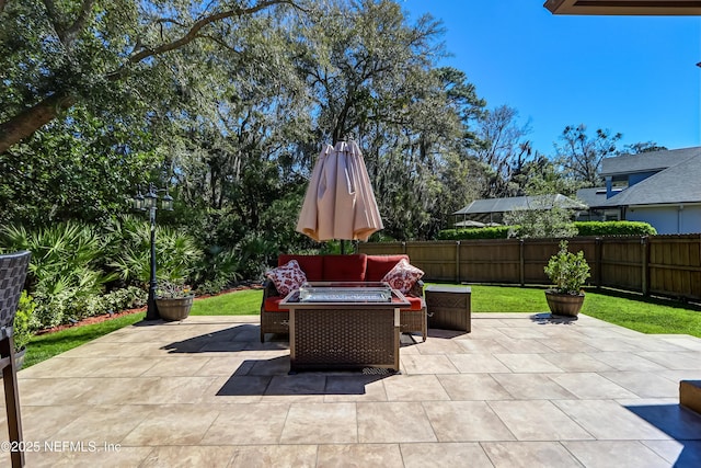 view of patio featuring a fenced backyard and an outdoor living space