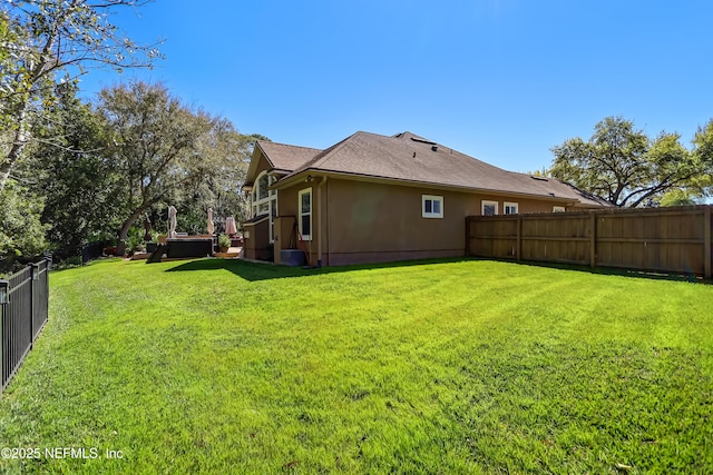 view of yard with a fenced backyard