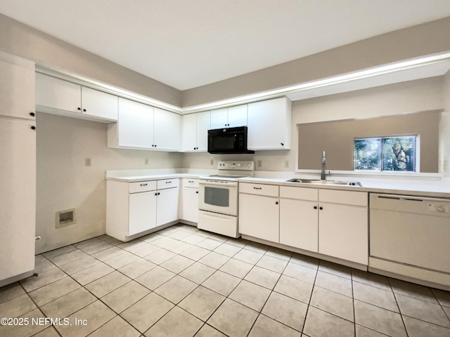 kitchen featuring white cabinetry, light tile patterned flooring, white appliances, and sink