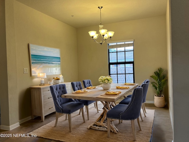 dining area featuring a notable chandelier