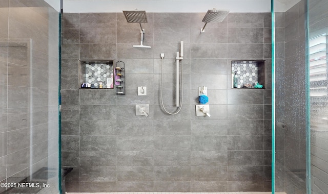 bathroom with a tile shower