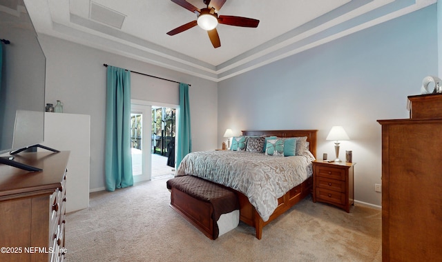 bedroom with ceiling fan, a raised ceiling, light carpet, and access to outside