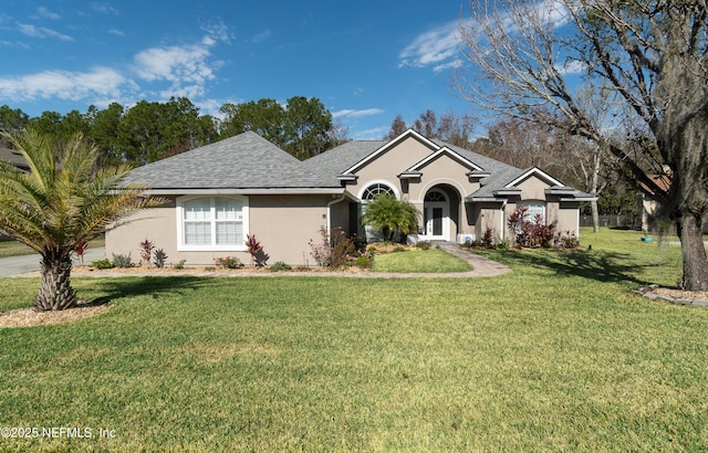 ranch-style home featuring a front yard