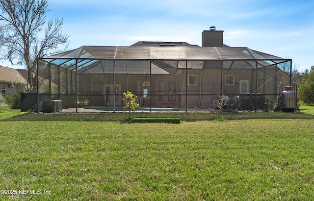 view of yard with glass enclosure