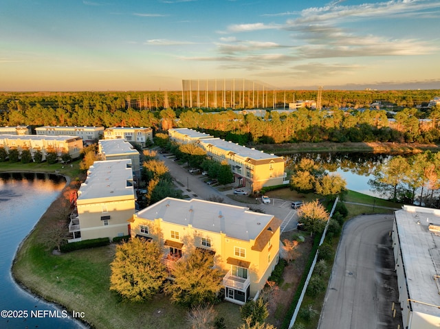 aerial view at dusk with a water view