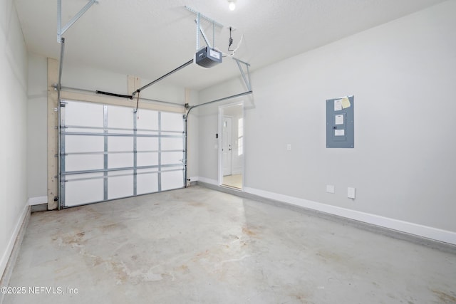 garage with electric panel and a garage door opener