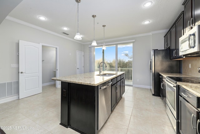 kitchen featuring light stone countertops, sink, pendant lighting, a center island with sink, and appliances with stainless steel finishes