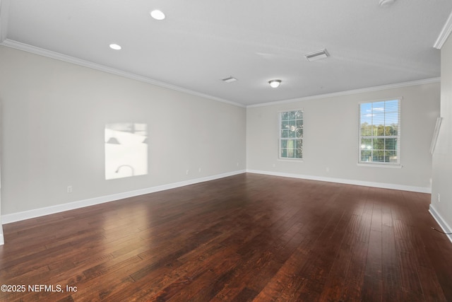 unfurnished room featuring ornamental molding and dark wood-type flooring