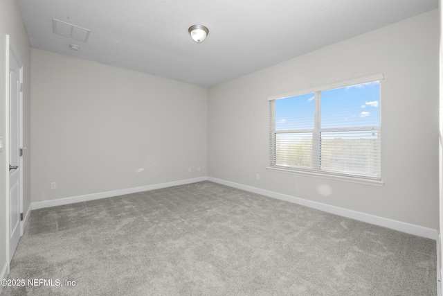 empty room with light colored carpet