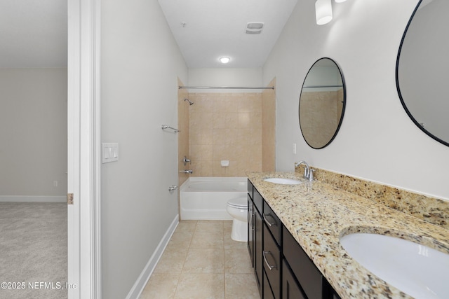 full bathroom featuring tile patterned flooring, vanity, toilet, and tiled shower / bath