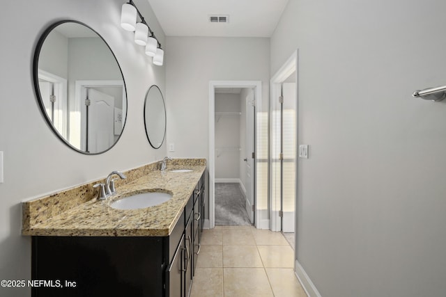 bathroom with tile patterned flooring and vanity