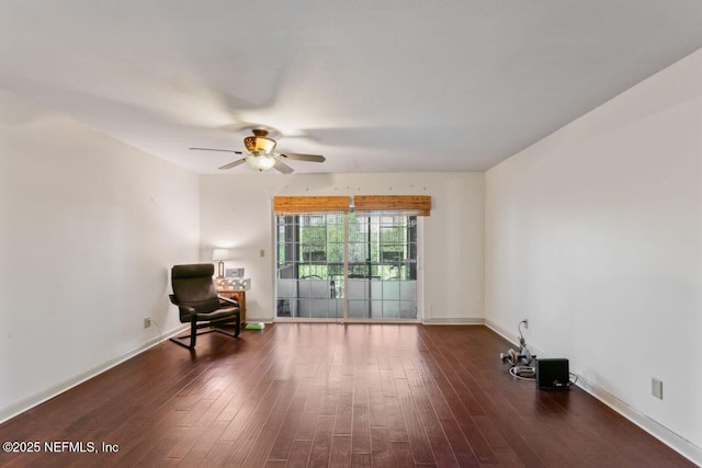 empty room featuring ceiling fan and dark hardwood / wood-style floors