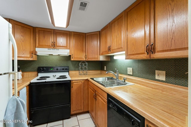 4308 Plaza Gate Ln S Unit 201, Jacksonville, FL 32217 - kitchen featuring under cabinet range hood, range with electric cooktop, black dishwasher, a sink, and light tile patterned flooring